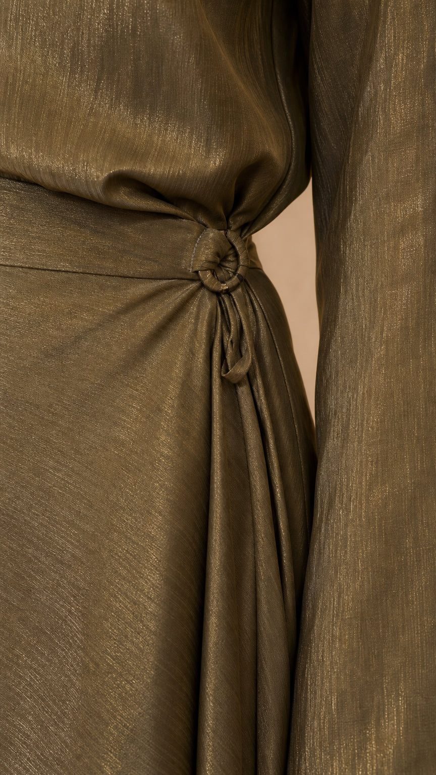 Close-up of side knot detail on olive satin top
