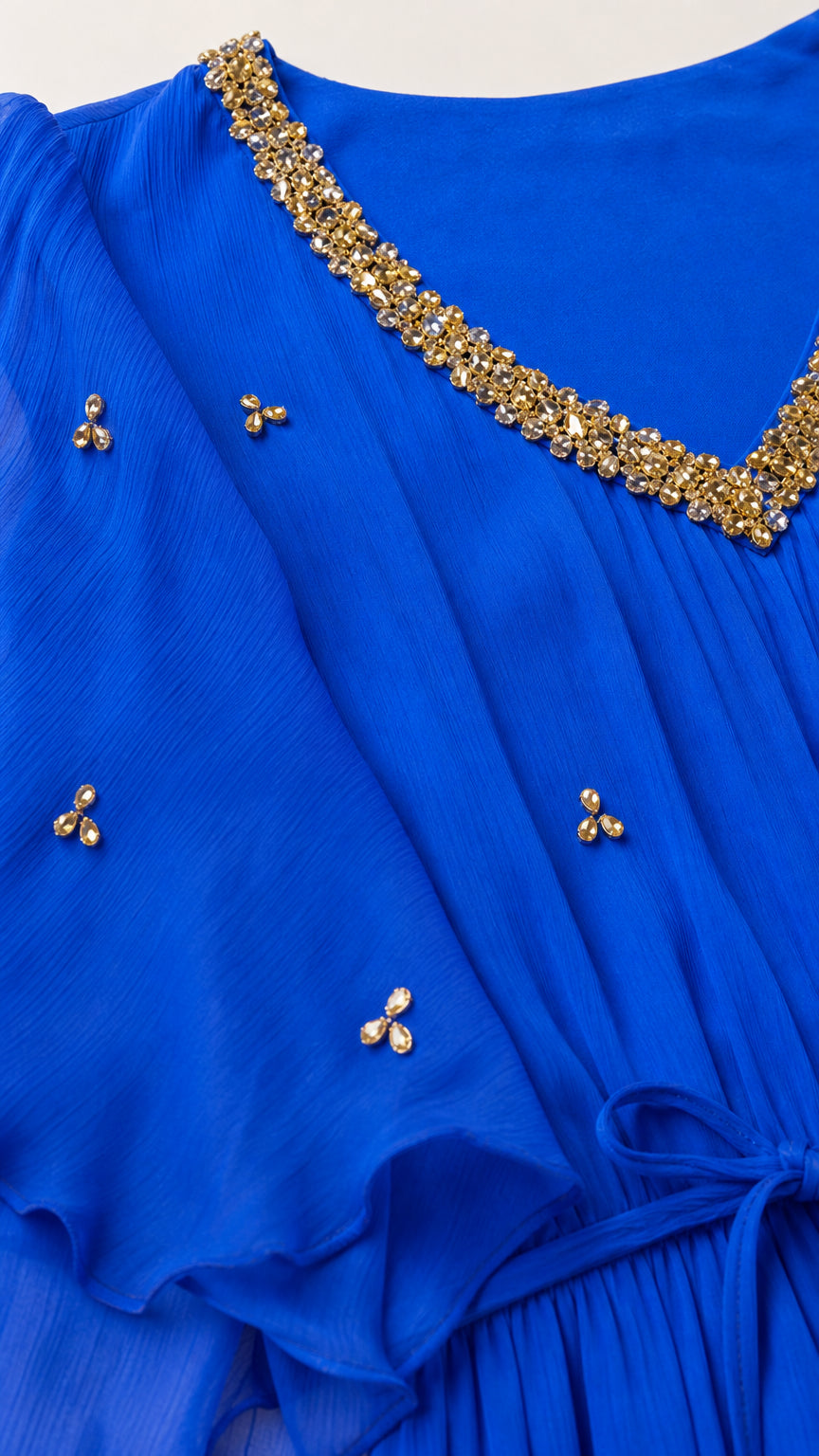 Close-up detail of rhinestone neckline and scattered beadwork on Royal Blue dress