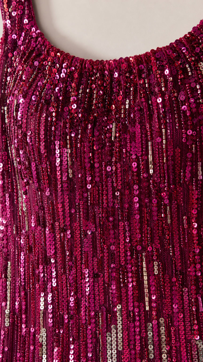 Close-up detail of shimmering berry purple sequin embroidery on scoop neckline