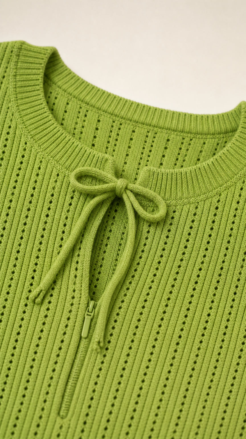 Close-up detail of Apple Green pointelle ribbed knit neckline with keyhole bow tie