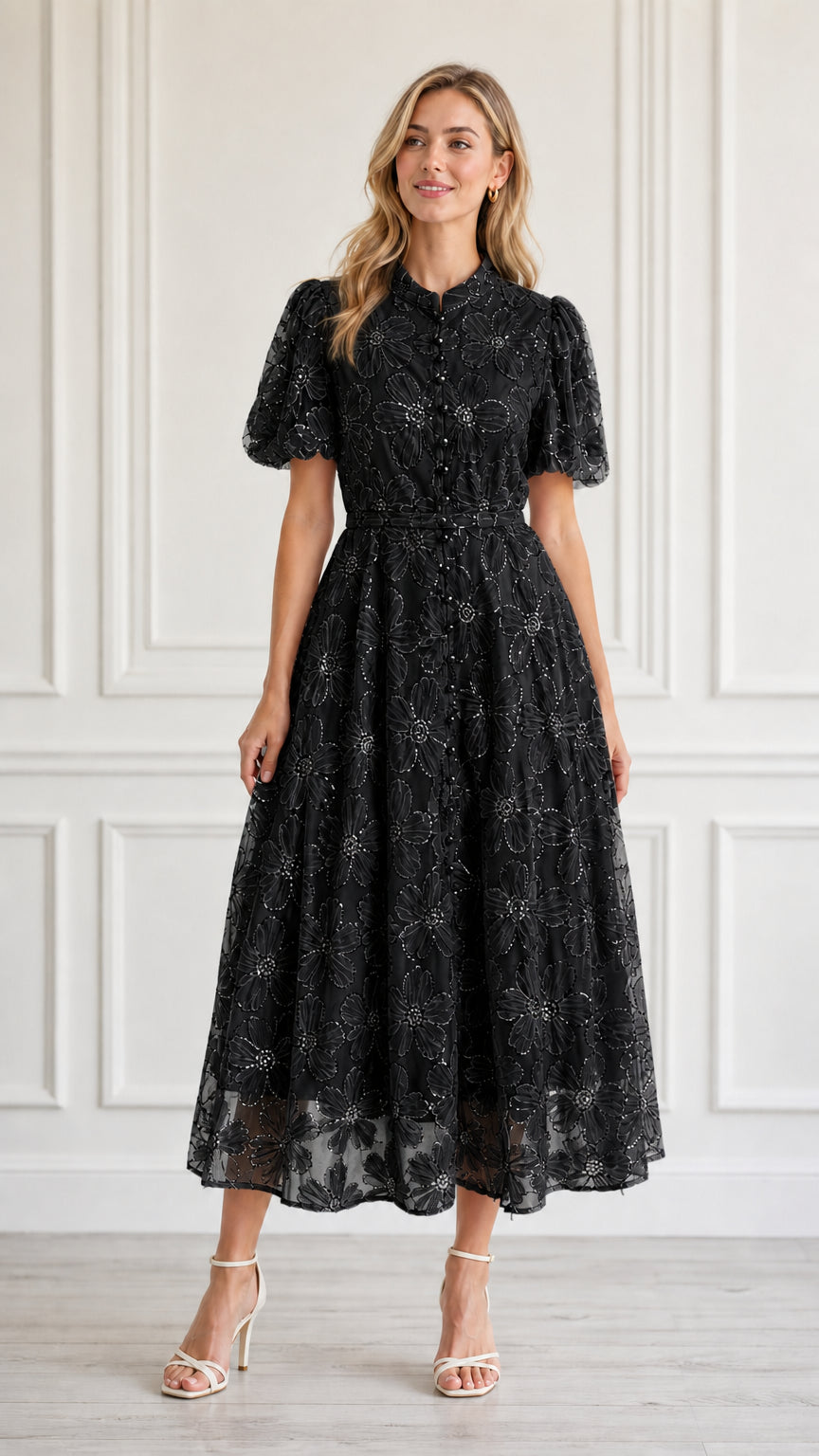 Front view of model wearing black floral embroidered midi dress