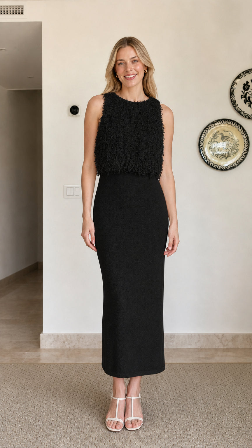 Model wearing black fringe textured sleeveless midi dress