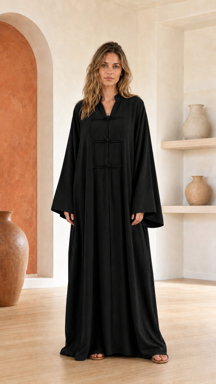 Front view of woman wearing black maxi dress