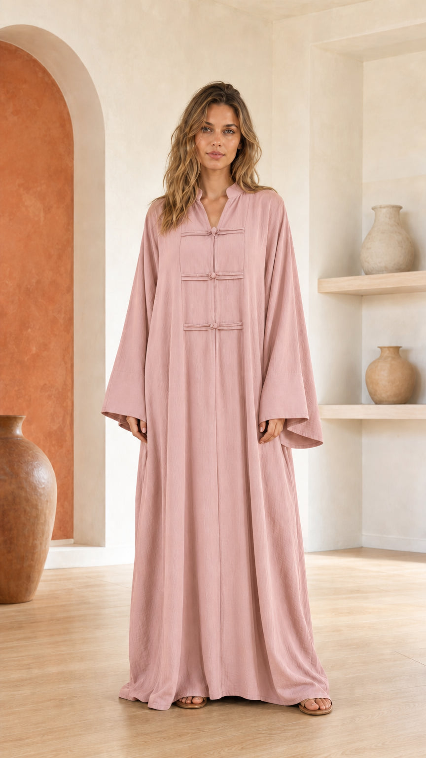 Front view of woman wearing pink maxi dress