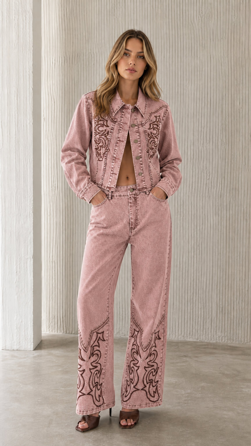 Full view of model wearing pink embroidered denim set