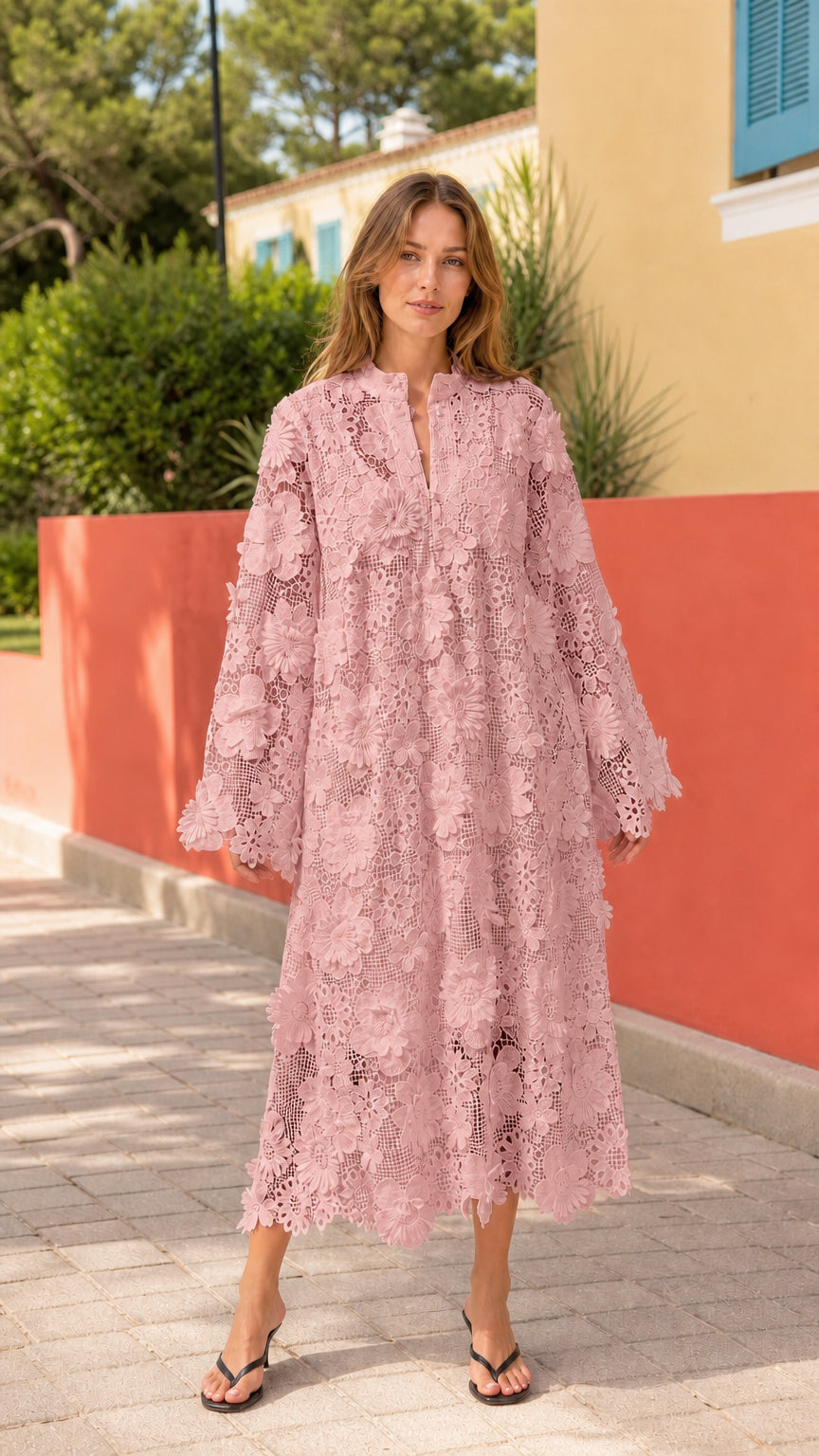 Front view of woman wearing pink floral lace midi dress