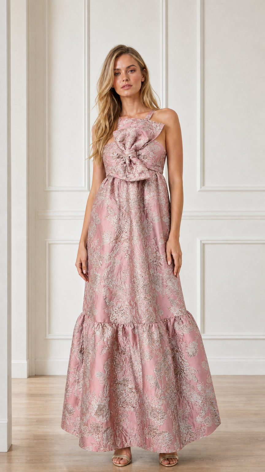 Front view of pink brocade maxi dress with bow