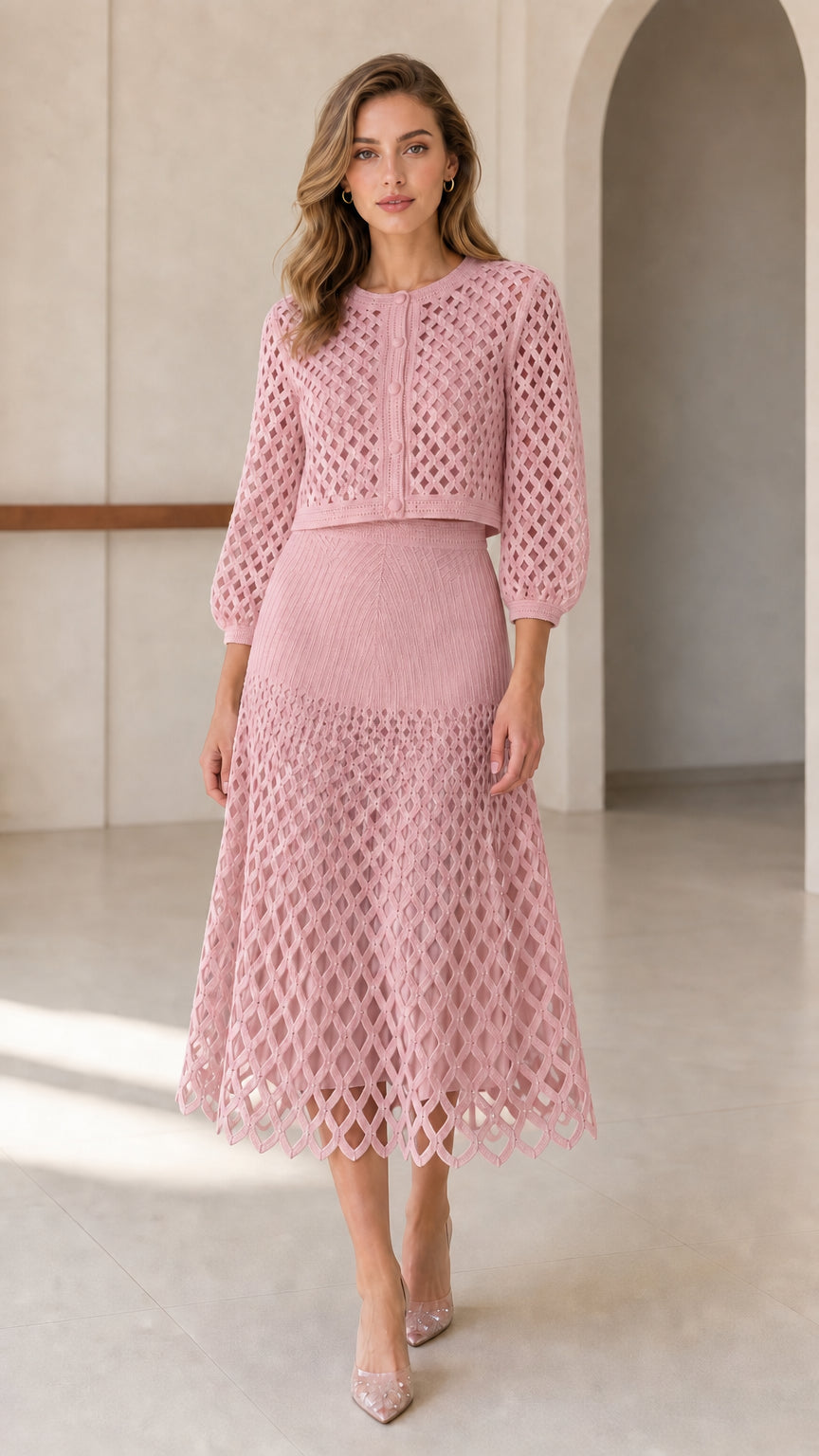 Model wearing pink open-knit cardigan and midi skirt set