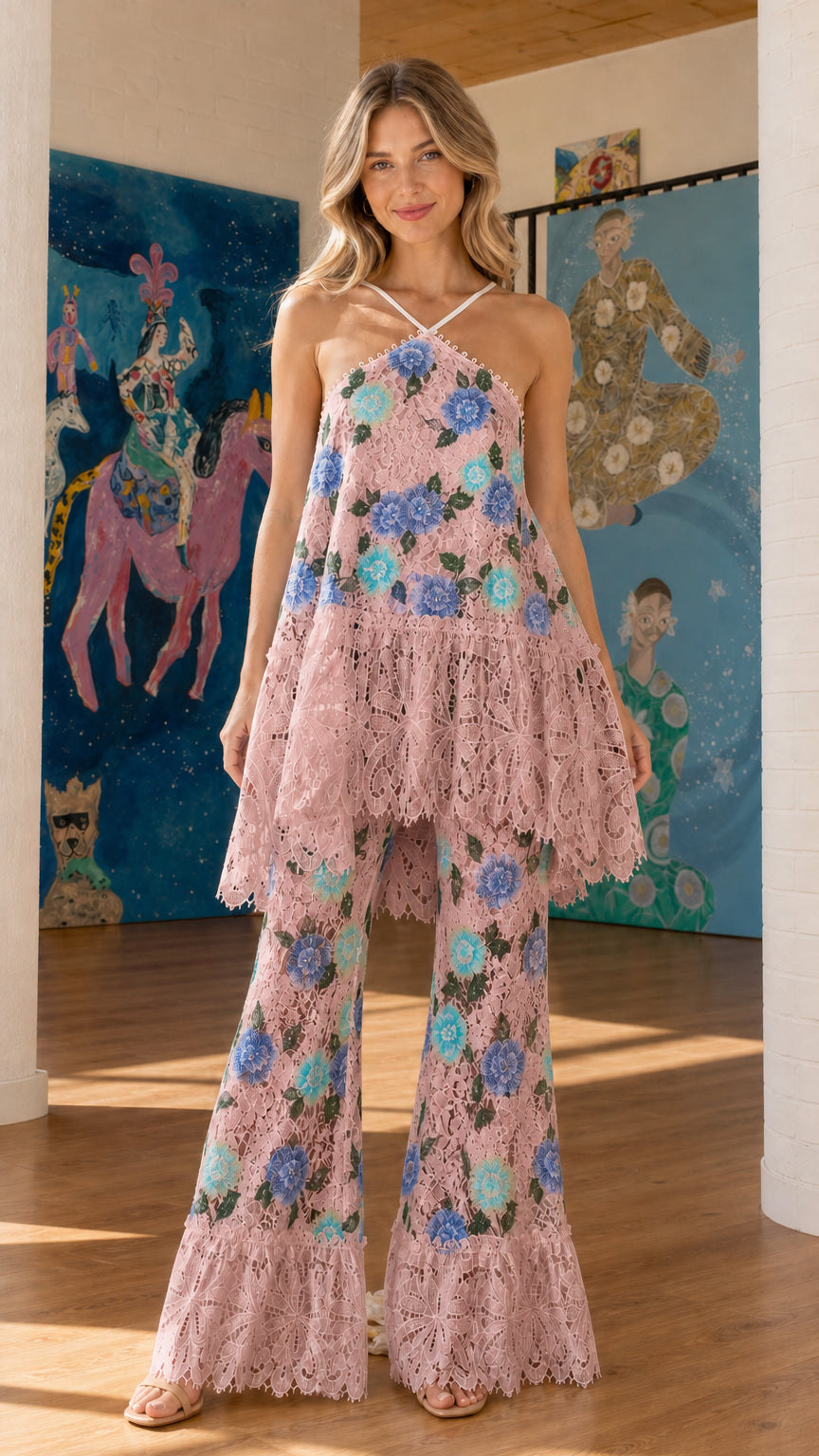 Front view of pink floral embroidered halter top and flared pants set