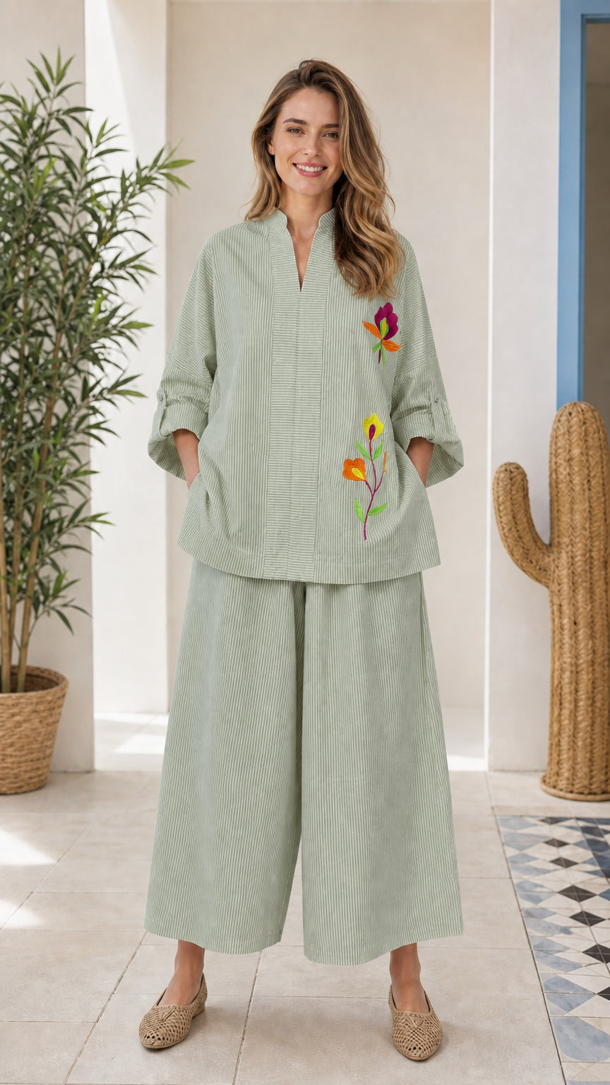 Front view of woman wearing sage green embroidered two-piece set