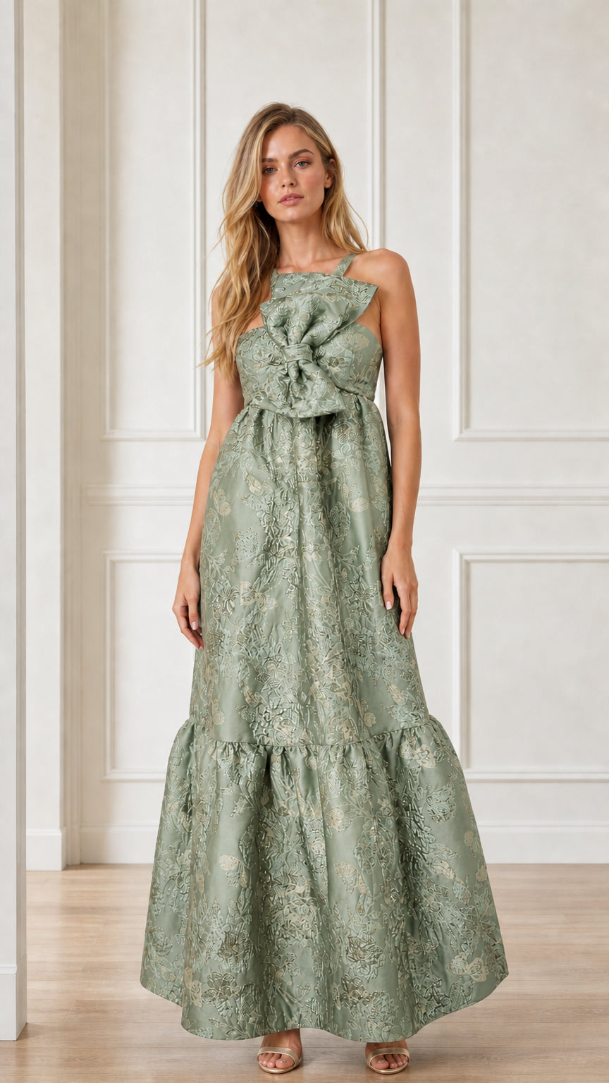 Front view of sage green brocade maxi dress with bow