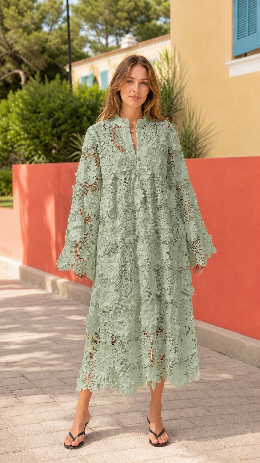 Front view of woman wearing green floral lace midi dress
