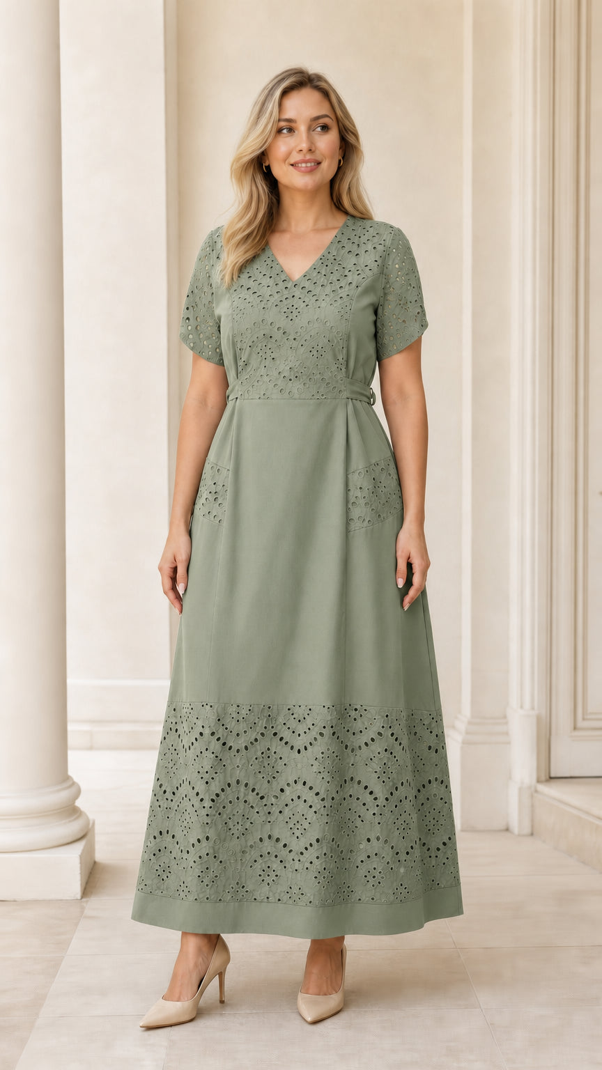 Full-length view of woman wearing sage green eyelet embroidered belted maxi dress