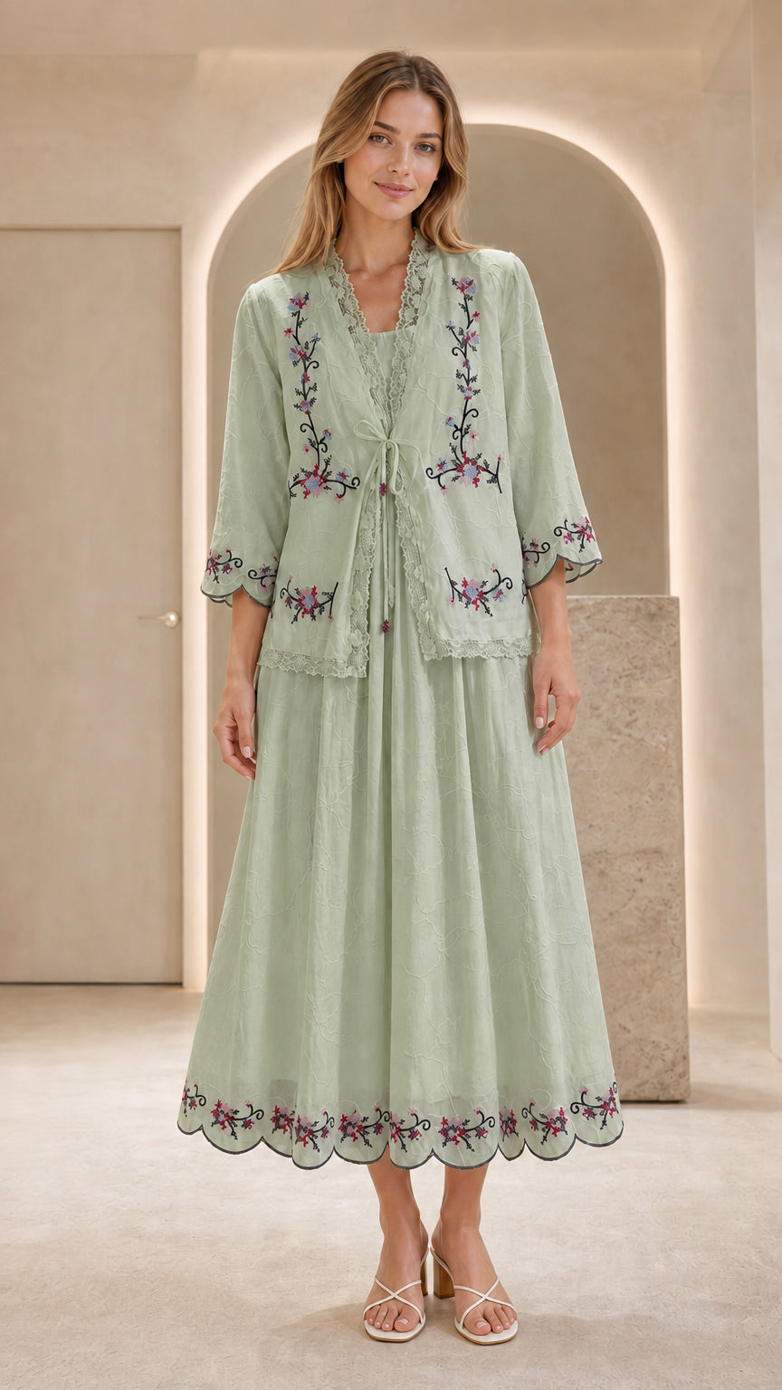 Front view of model wearing sage green embroidered two-piece dress set