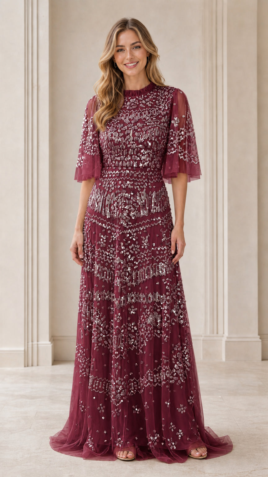 Front view of model wearing burgundy sequin evening gown