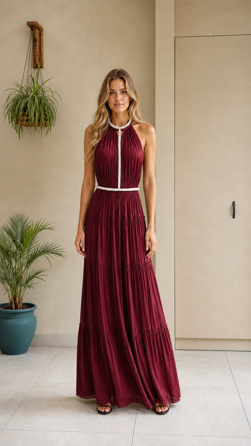Model wearing the burgundy color variant of the pleated maxi dress