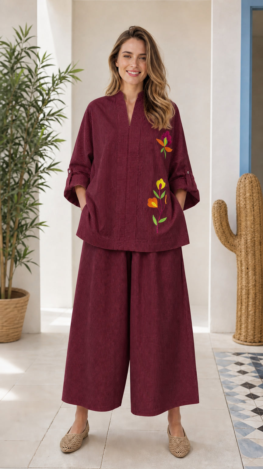 Front view of woman wearing burgundy embroidered two-piece set