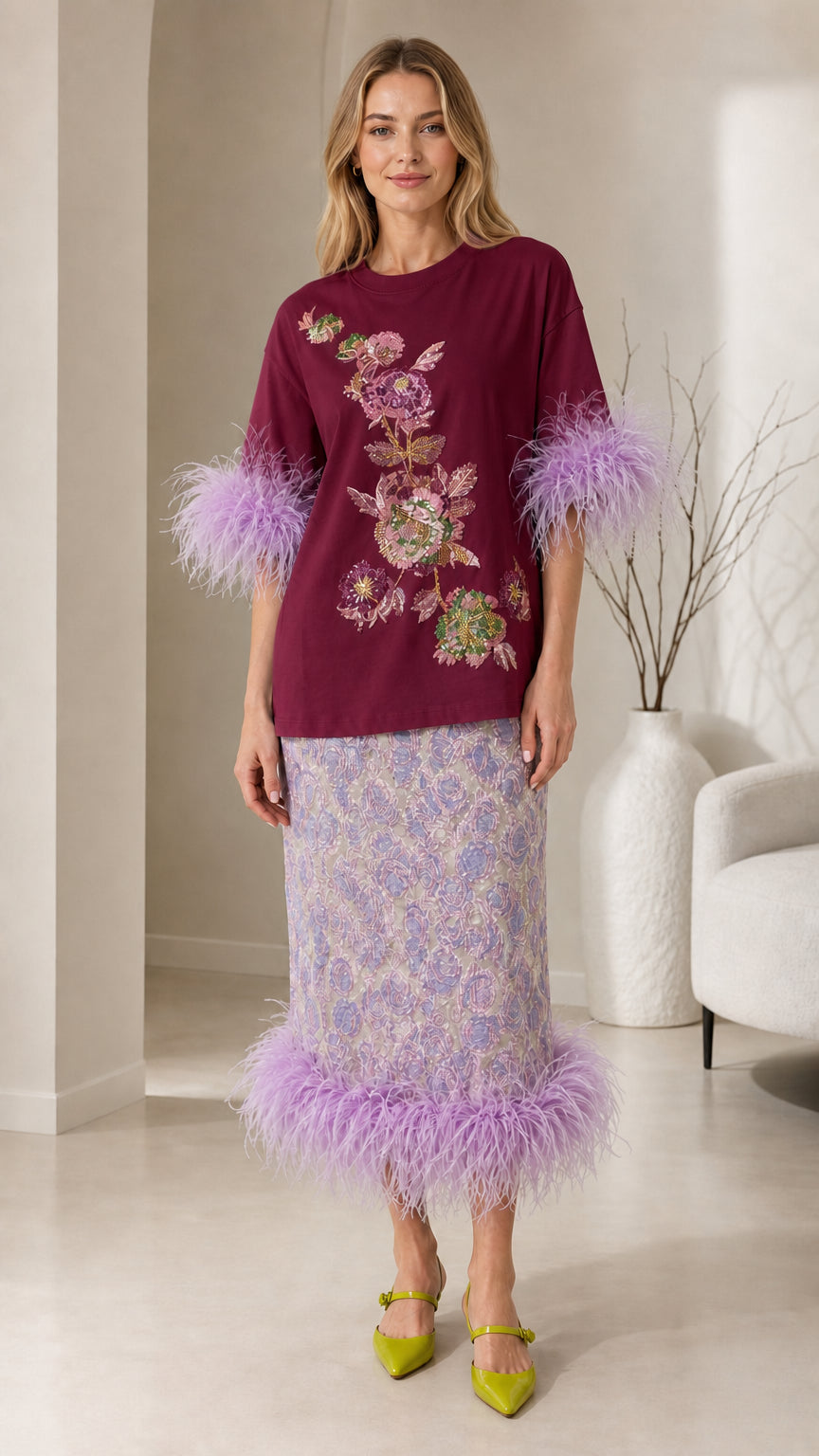 Front view of burgundy color variant with feather trim