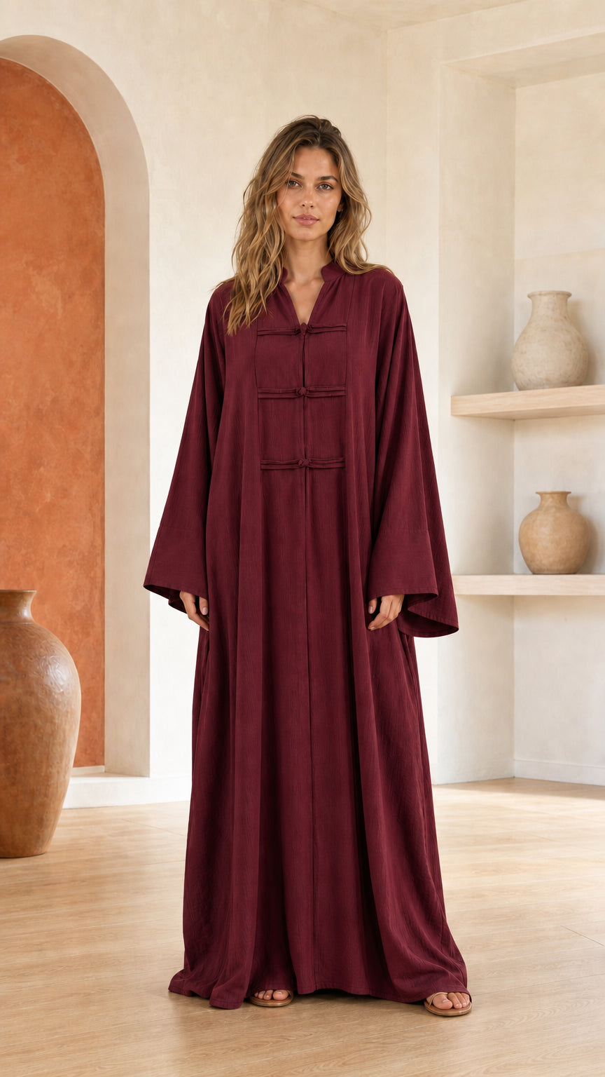 Front view of woman wearing burgundy maxi dress