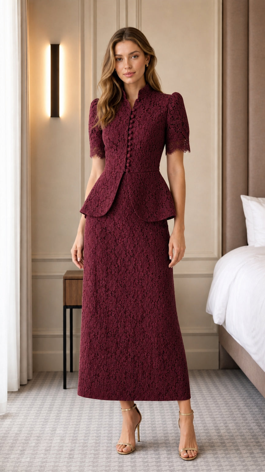 Full view of woman wearing burgundy lace peplum skirt set