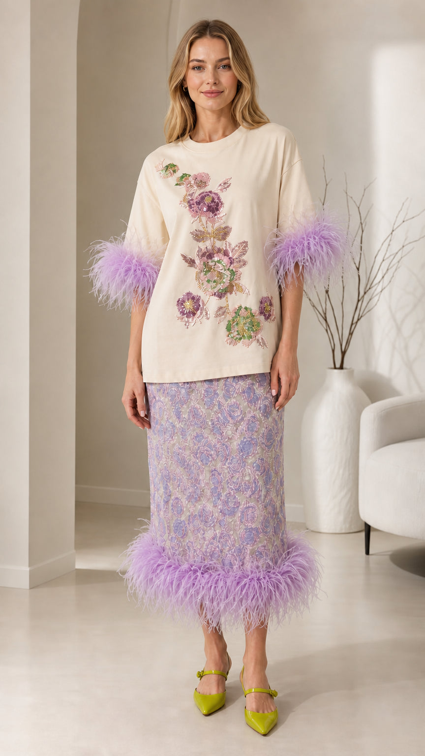 Front view of cream color variant with feather trim