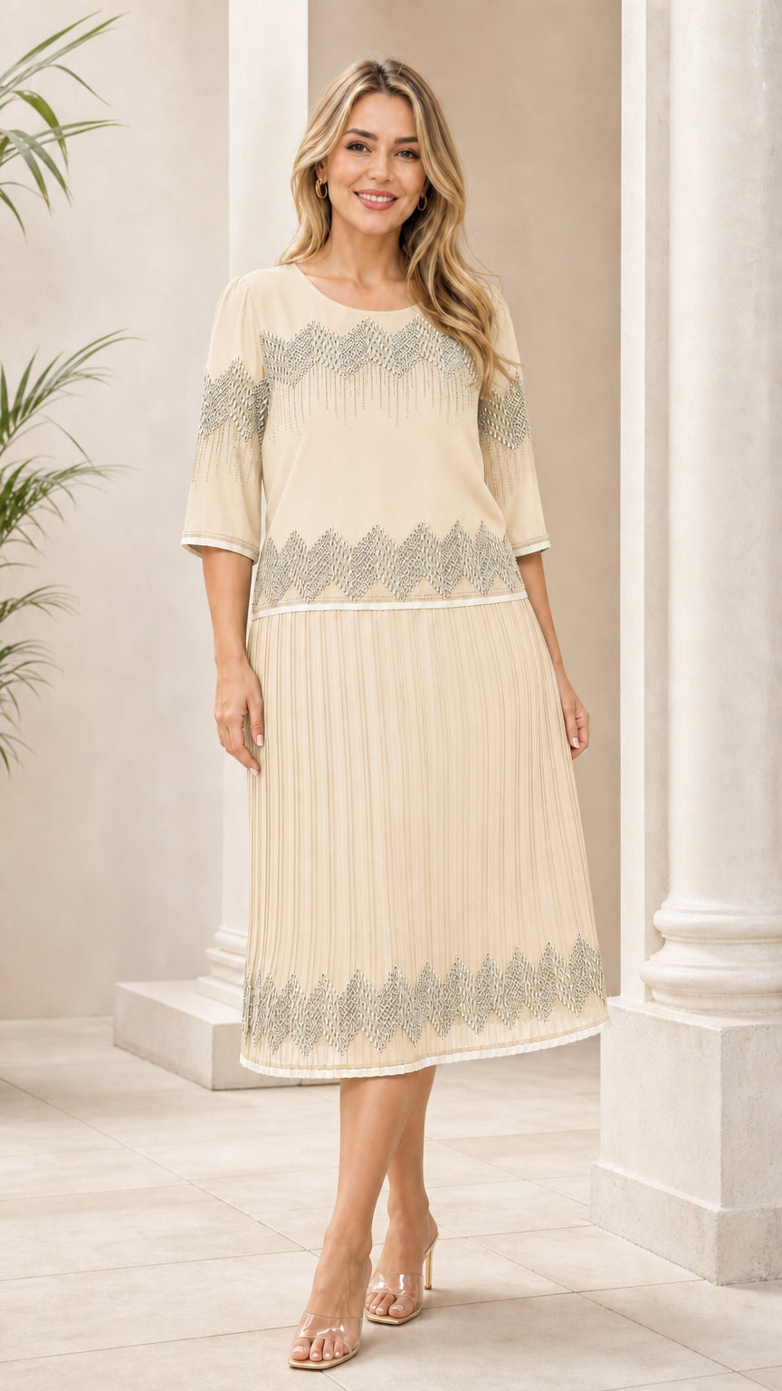 Ivory geometric pleated midi dress shown from the front