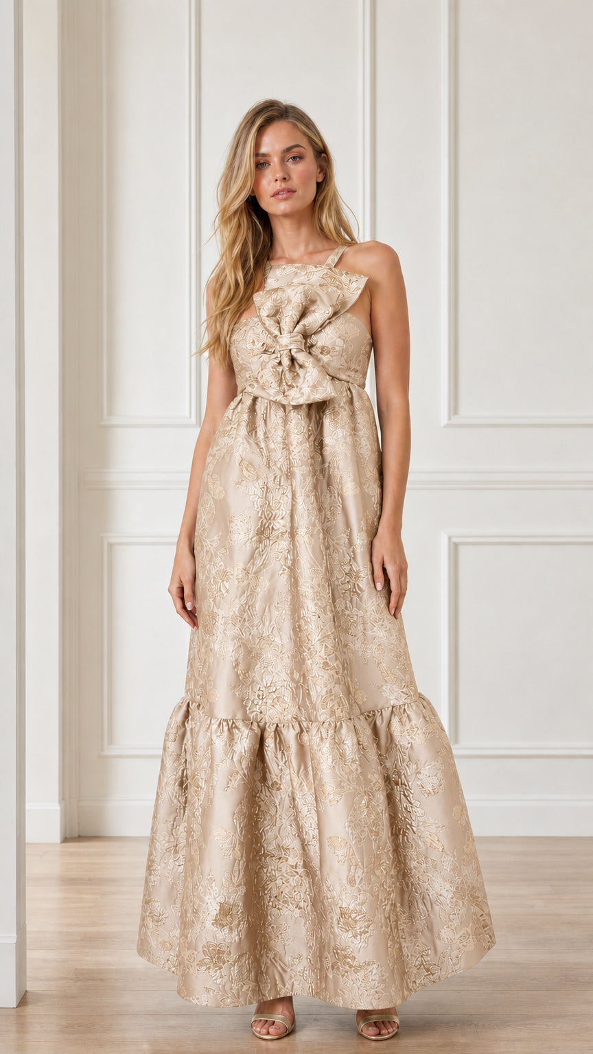 Front view of champagne brocade maxi dress with bow